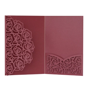 Laser-cut burgundy wedding invitation sleeve with elegant rose floral hollow design