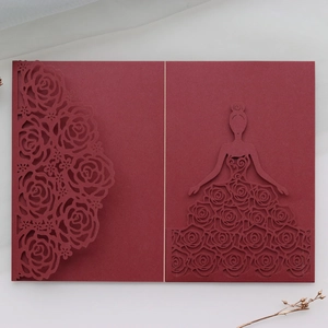 Detailed laser-cut burgundy invitation featuring elegant rose pattern and girl silhouette