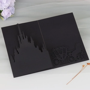 Exquisite laser cut black castle invitation with ornate carriage silhouette detailing
