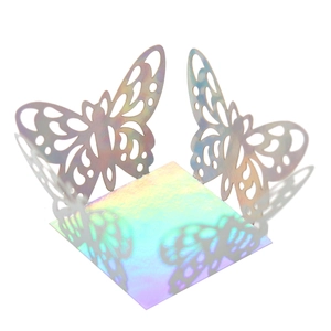 Macro view of holographic laser cut butterfly candy box with intricate lace details