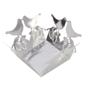 Laser-cut silver wedding candy box with intricate hollow bird and floral vine patterns