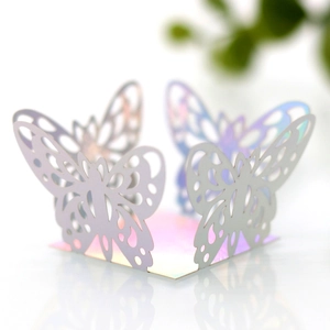 Detail of pink laser-cut butterfly candy box with pearlescent finish and intricate patterns