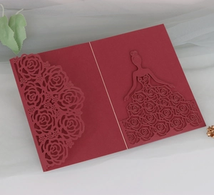 Macro detail of laser-cut burgundy rose wedding invitation with elegant girl silhouette