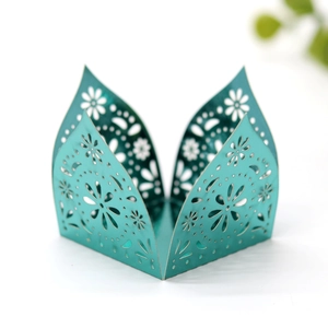Laser-cut floral hollow decoration in vibrant turquoise for party and candy box packaging