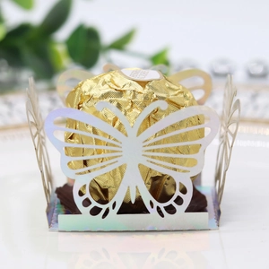 Detailed laser-cut holographic butterfly paper holder for chocolates or party cupcakes