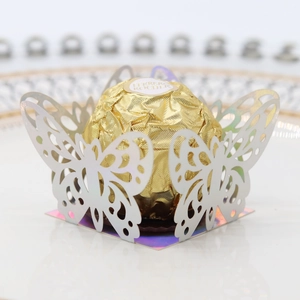 Macro detail of laser-cut laser-cut butterfly candy wrapper for wedding party favor