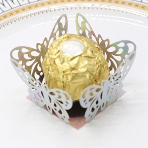 Macro detail of laser-cut butterfly chocolate paper wrapper with pearlescent texture