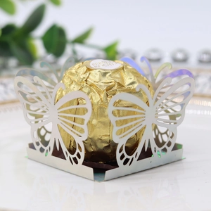 Detailed laser-cut butterfly candy box with iridescent white finish for party favors