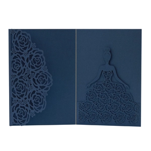 Detail of laser-cut rose floral lace and female silhouette on navy blue invitation card