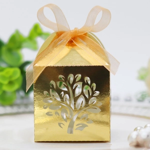 Laser-cut Tree of Life candy box in gold finish with ribbon for wedding party favors