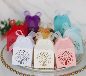Macro detail of multicolored laser-cut tree gift boxes with elegant ribbon bows