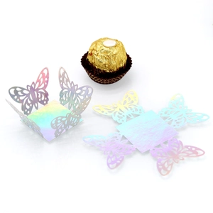 Iridescent laser-cut butterfly wrapper for chocolate decoration at weddings and parties