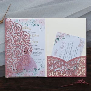 Detail of pink glitter laser cut rose invitation set with floral inner cards and RSVP card