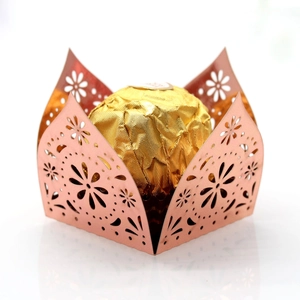 Macro shot of rose gold laser-cut floral candy box with metallic glossy finish