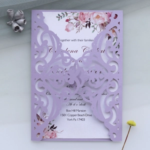 Detail showing laser-cut lavender floral envelope and watercolor flower wedding invitation card