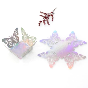 Macro shot of iridescent laser-cut butterfly candy box with colorful metallic finish