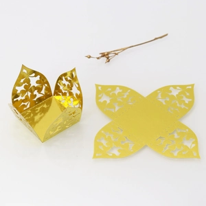 Detail of laser-cut gold floral candy box shown in flat and folded assembly