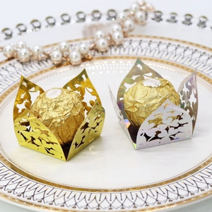 Laser-cut floral chocolate wrappers in gold and silver for wedding dessert table decor