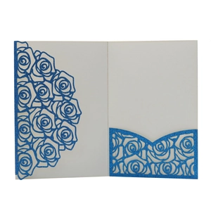 Close-up of laser-cut rose patterns and glittery pocket on the wedding invitation card