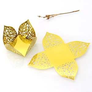 Detailed laser-cut pattern on gold mirror paper gift box showing folded and flat state