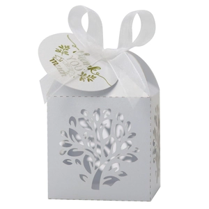 Detail of white laser-cut Tree of Life candy box with ribbon and Thank You tag