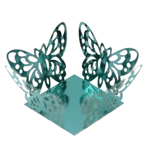 Detailed laser-cut butterfly cupcake wrapper in glossy cyan metallic finish
