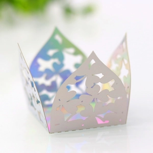 Macro detail of laser-cut clover pattern on iridescent hollow chocolate candy box