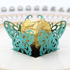 Macro shot of laser-cut hollow butterfly chocolate box in light blue finish