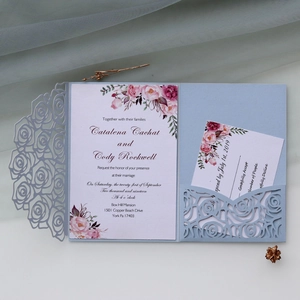 Detailed laser-cut blue rose wedding invitation with elegant floral watercolor card set