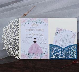 Detail of laser cut rose invitation with glitter pocket and Quinceañera floral design