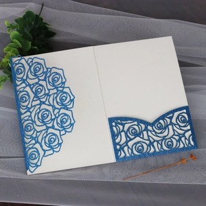 Detail of navy blue glitter laser-cut rose pocket for wedding invitations with floral motifs