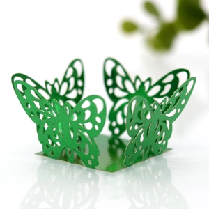 Detail of laser-cut butterfly candy box decoration in elegant emerald green finish