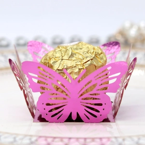 Detailed laser-cut hollow butterfly chocolate wrap in vibrant rose pink for party decor
