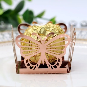 Detail of rose gold laser-cut butterfly candy box for wedding and party favors