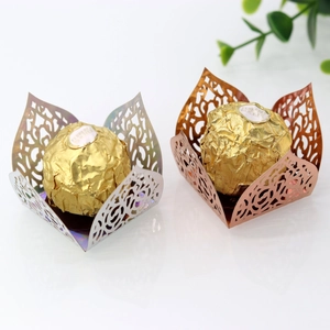 Detailed laser-cut vine patterns on silver and rose gold chocolate wrappers