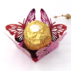Macro detail of laser-cut butterfly chocolate wrap for wedding party decoration