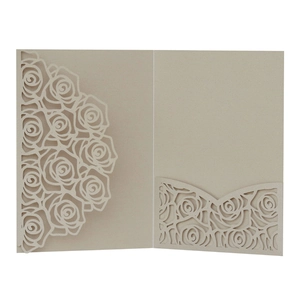 Detailed laser-cut rose pattern on champagne gold pearlescent paper invitation card cover