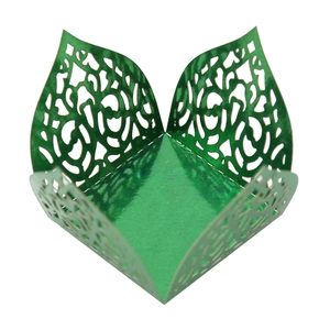 Detailed laser-cut dark green candy box with intricate floral hollow lace patterns