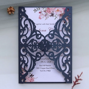 Detailed laser-cut navy invitation featuring floral patterns and elegant hollow craftsmanship