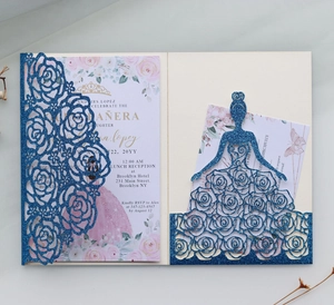 Detail of laser-cut rose invitation with blue glitter finish and floral inner card