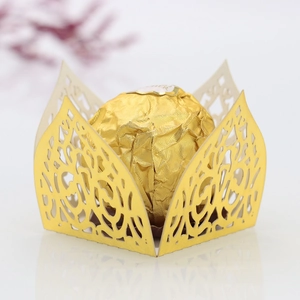 Laser cut gold mirror paper chocolate wrapper with intricate floral hollow design