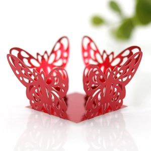 Macro shot of laser-cut red butterfly candy box with detailed hollow patterns