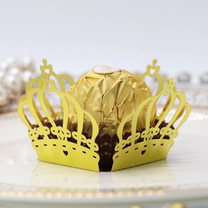 Laser-cut gold crown chocolate wrapper with heart patterns for festive party favors