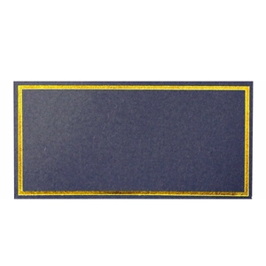 Detailed macro view of dark blue wedding place card with elegant gold foil border