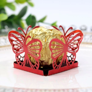 Detail of red laser-cut butterfly chocolate wrapper for wedding party favor decorations