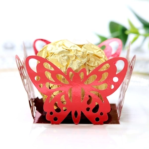 Close-up of red laser-cut butterfly chocolate holder with gold foil truffle detail