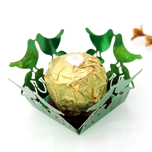 Laser cut green metallic candy tray with bird silhouette and Ferrero chocolate detail