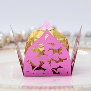 Intricate laser-cut butterfly clover chocolate box with golden candy tray detail