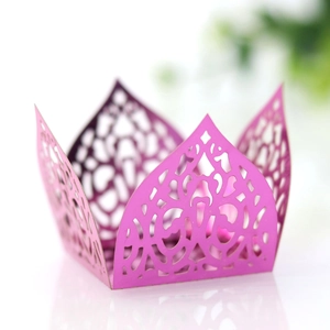 Macro detail of laser-cut purple paper candy box with intricate European scroll patterns