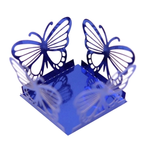 Macro view of blue laser-cut butterfly hollow gift box with metallic mirror finish